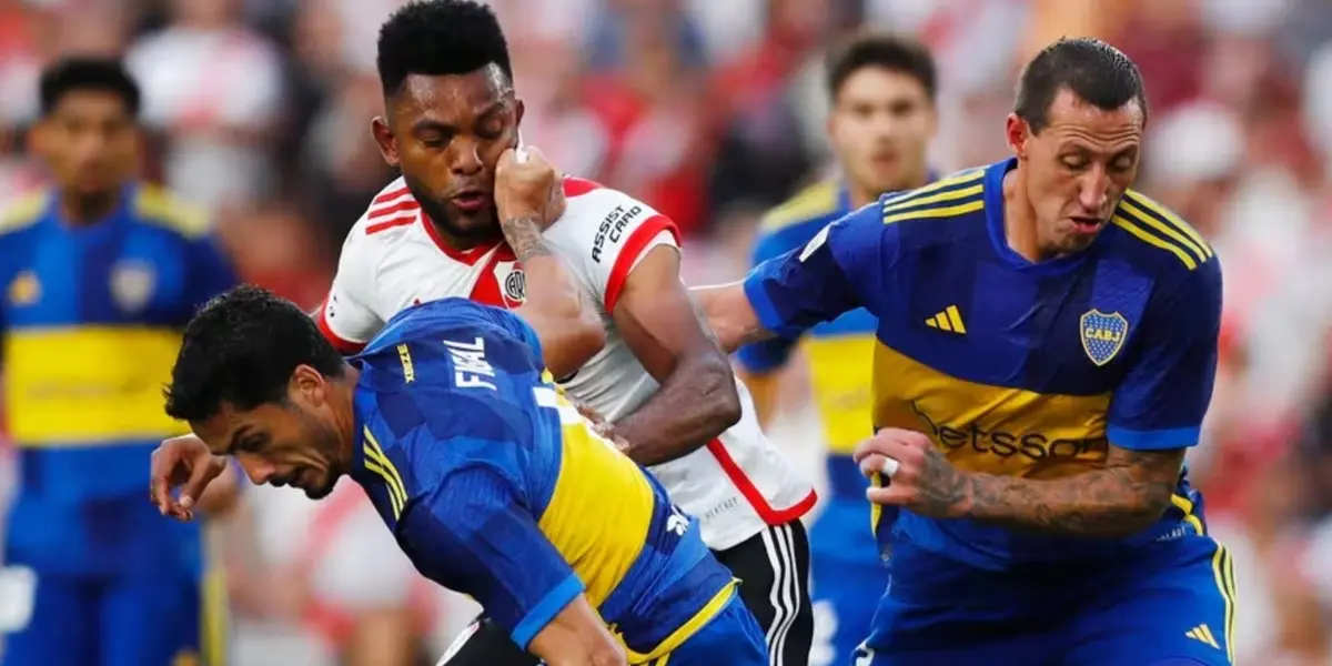 Nicolás Figal y Cristian Lema en acción durante el Superclásico.