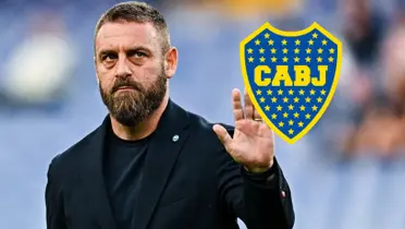 Daniele De Rossi de traje junto al escudo de Boca.