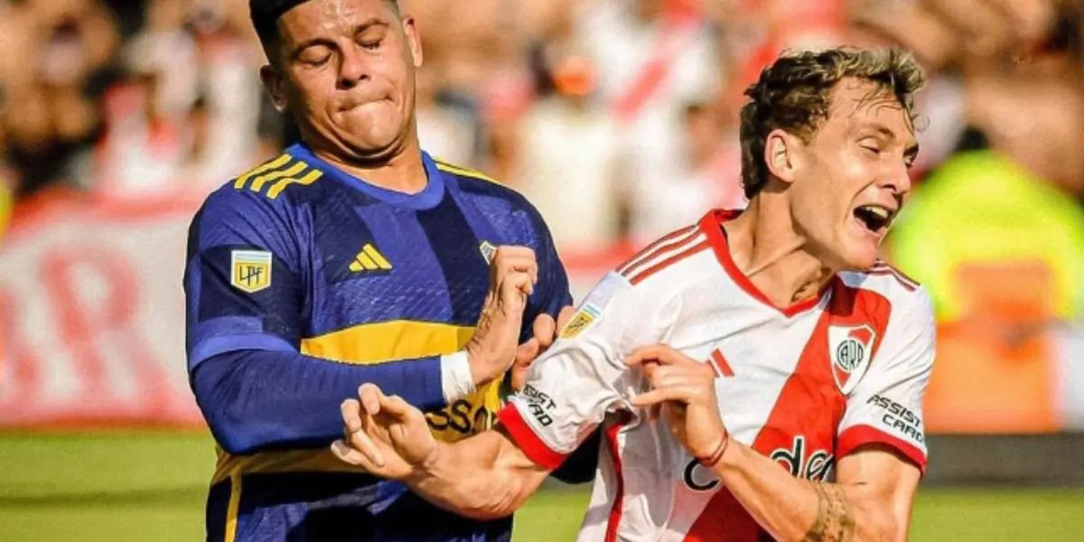 Marcos Rojo atendiendo a Colidio en el Superclásico.